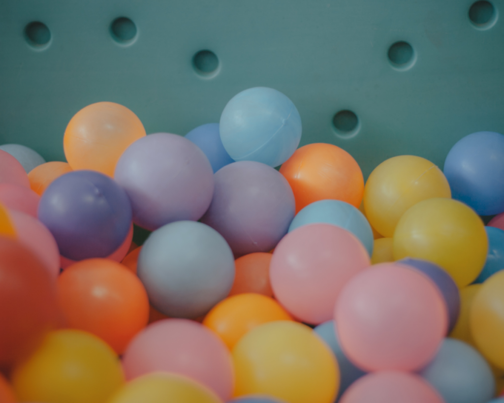 Plastic balls in a ball pit.