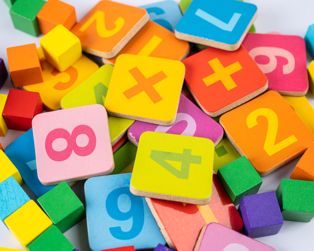 Number tiles and blocks used for preschool number recognition.